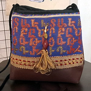 Leather handbag with Armenian fabric