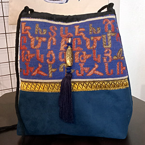 Leather handbag with Armenian fabric