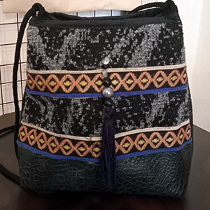 Leather handbag with Armenian fabric