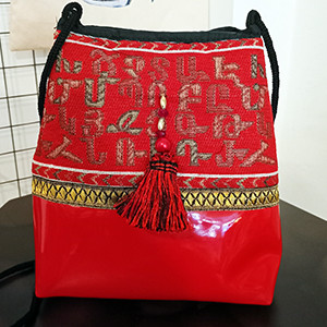 Leather handbag with Armenian fabric
