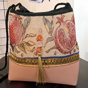 Leather handbag with Armenian fabric